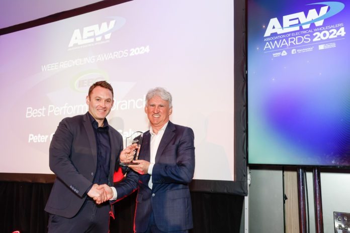 Tommy Curran of Peter Curran Electric Ltd Galway receiving an award for “Best Performing Branch” for lighting recycling at Ireland’s second Association of Electrical Wholesalers (AEW) awards in Dublin